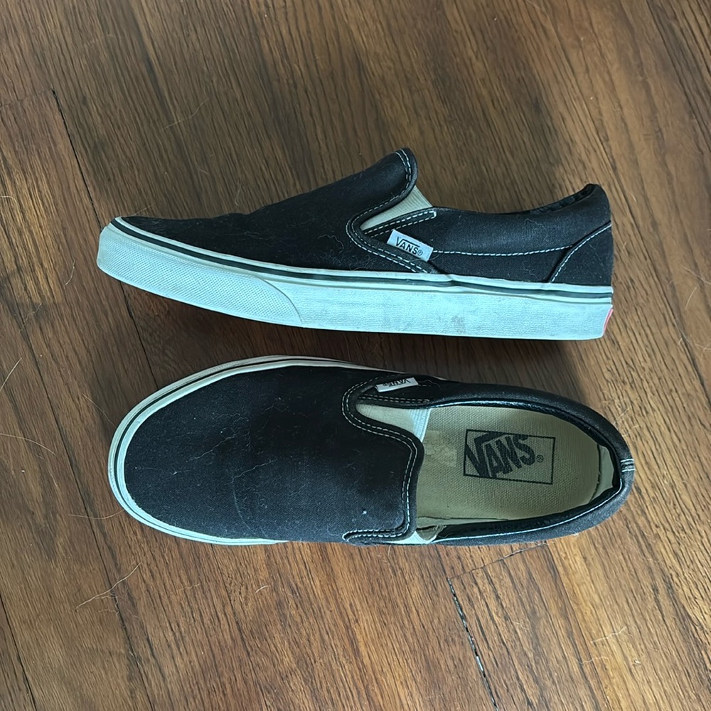 black vans off the wall slip ons